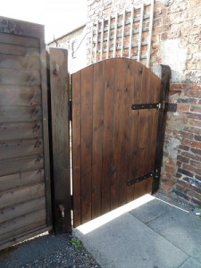 Hang new garden side gate and stain